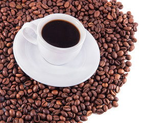 Cup of coffee with saucer and beans on white background