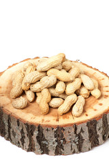 Pile of unshelled peanuts, isolated on white background