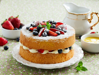 Genoise (cake) with cream, berries and lemon cream.