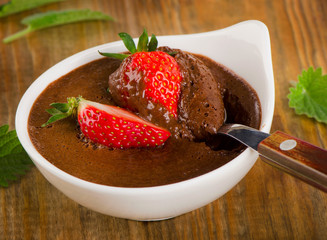 Homemade Chocolate Mousse with fresh berries on a old rustic