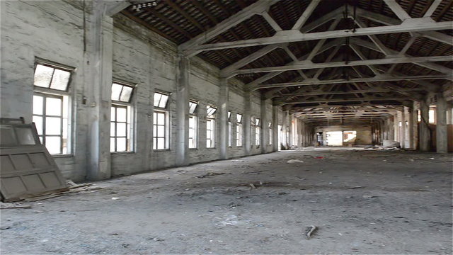 Empty industrial loft in an architectural background with bare cement walls, floors and pillars