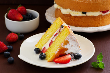 Genoise (cake) with cream, berries and lemon cream.