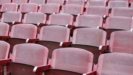 red empty chairs in the stadium