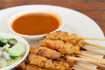 grilled pork satay with peanut sauce and vinegar