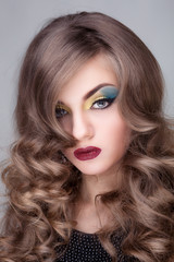 Fototapeta premium Beautiful girl with colorful make up