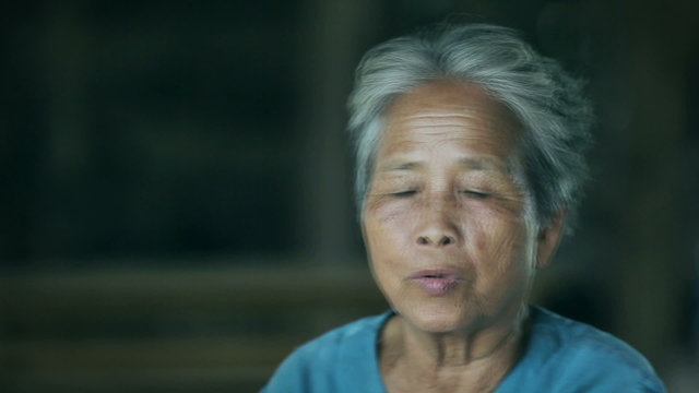 Asian grandmother talking something