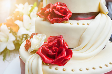 Closeup of elegant wedding cake with edible decoration
