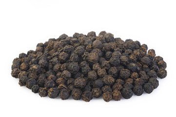 Black pepper seeds on white background