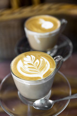 Cup of art latte on a cappuccino coffee
