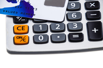 Credit card with calculator isolated on white background