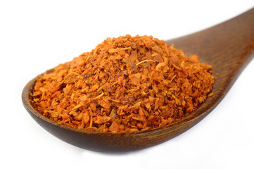 cayenne pepper in wooden spoon