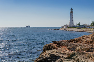 destroyed ship and lighthouse