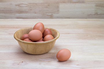 hen's eggs in wooden bowl