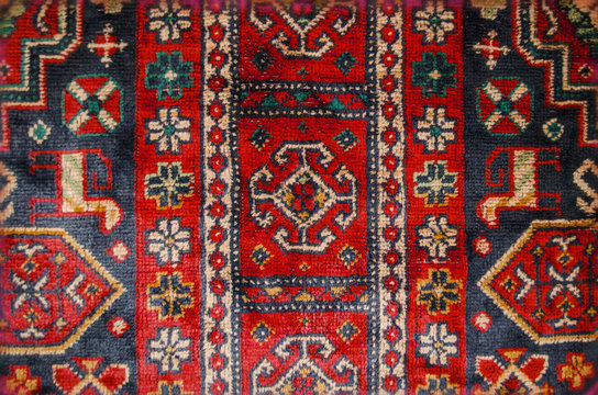 Part borders vintage silky thin carpet with ethnic pattern