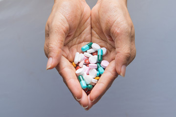 various tablets pills in hand