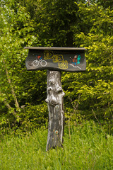mountain bike and hiking trail signpost, 
made of wood