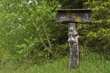 mountain bike and hiking trail signpost, 
made of wood