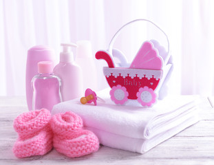 Baby accessories on table on light background