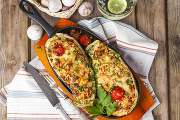 Aubergine stuffed with vegetables and cheese