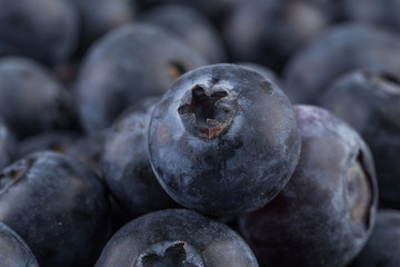 Blueberries on stone plate background