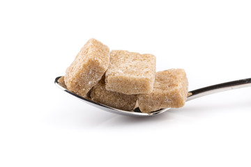 Cubes of sugar on a spoon