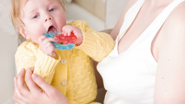 Happy rattle in baby hands