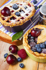 Decorated homemade shortcrust pastry berry pies