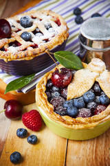 Decorated homemade shortcrust pastry berry pies