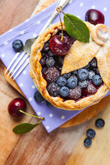 Decorated homemade shortcrust pastry berry pie
