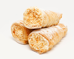 Fresh puff pastry with cream isolated