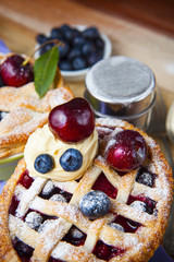 Decorated homemade shortcrust pastry berry pies