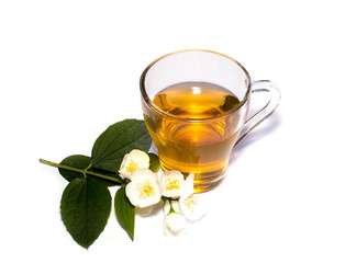 glass of the lime tea decorated with a flower branch