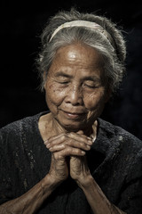 Portrait of a senior woman praying