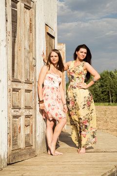 Two girls posing in an old house