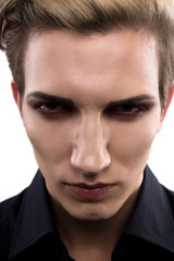 Serious male model with makeup