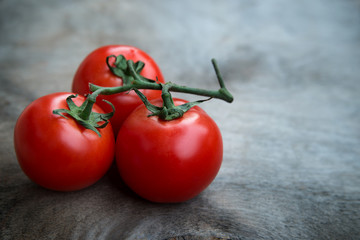 fresh red delicious tomatoes  in heart shape plate