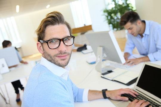 Businessman with eyeglasses working in office