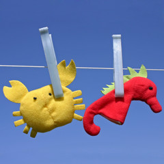 Funny toys hanging on clothesline © BOOCYS