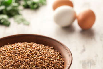 Ceramic bowl with buckwheat.