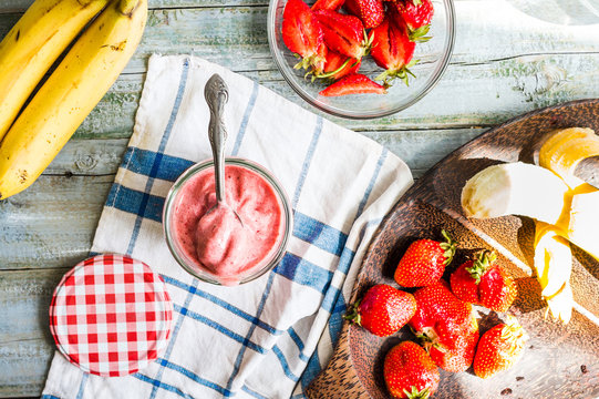 strawberry ice cream in a glass fruit dessert, summer, raw banan