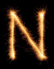 "N" letter drawn with bengali sparkles