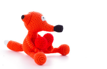 Knitted fox toy isolated on white background