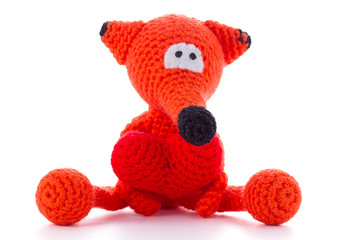 Knitted fox toy isolated on white background