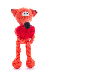 Knitted fox toy isolated on white background