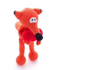 Knitted fox toy isolated on white background