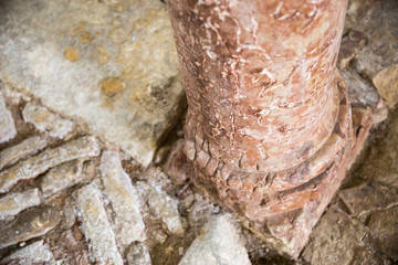 antique marble columns resting on stone floor