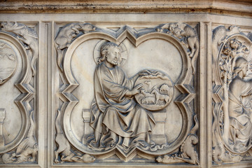 Paris -  the Sainte-Chapelle (Holy Chapel).The base of the portal on both sides is decorated with low relief representing scenes of the Genesis