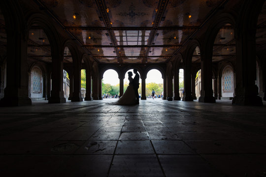 Unidentified married couple silouette under Bethesda Terrace in
