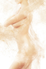 shy naked woman body in sand powder