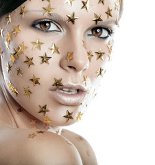 Close up woman fase shot with stars on face